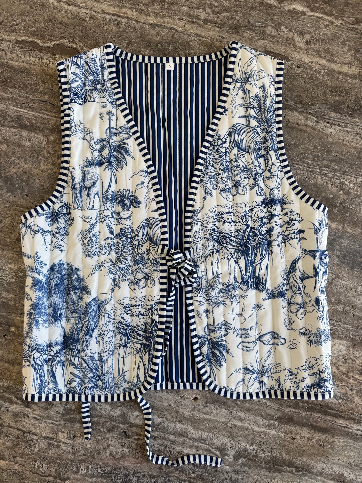 blue drawing vest