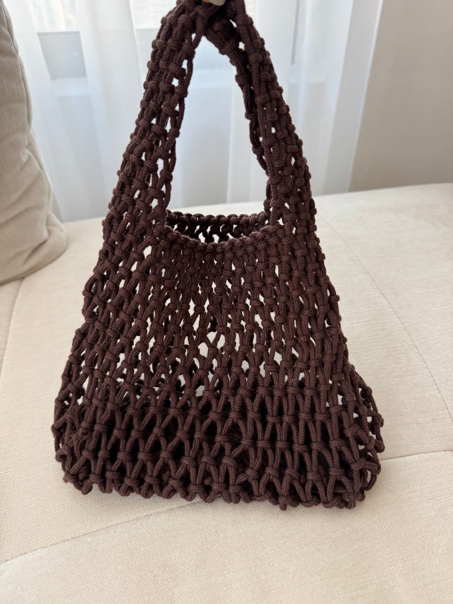 brown net beach bag