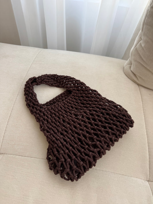 brown net beach bag